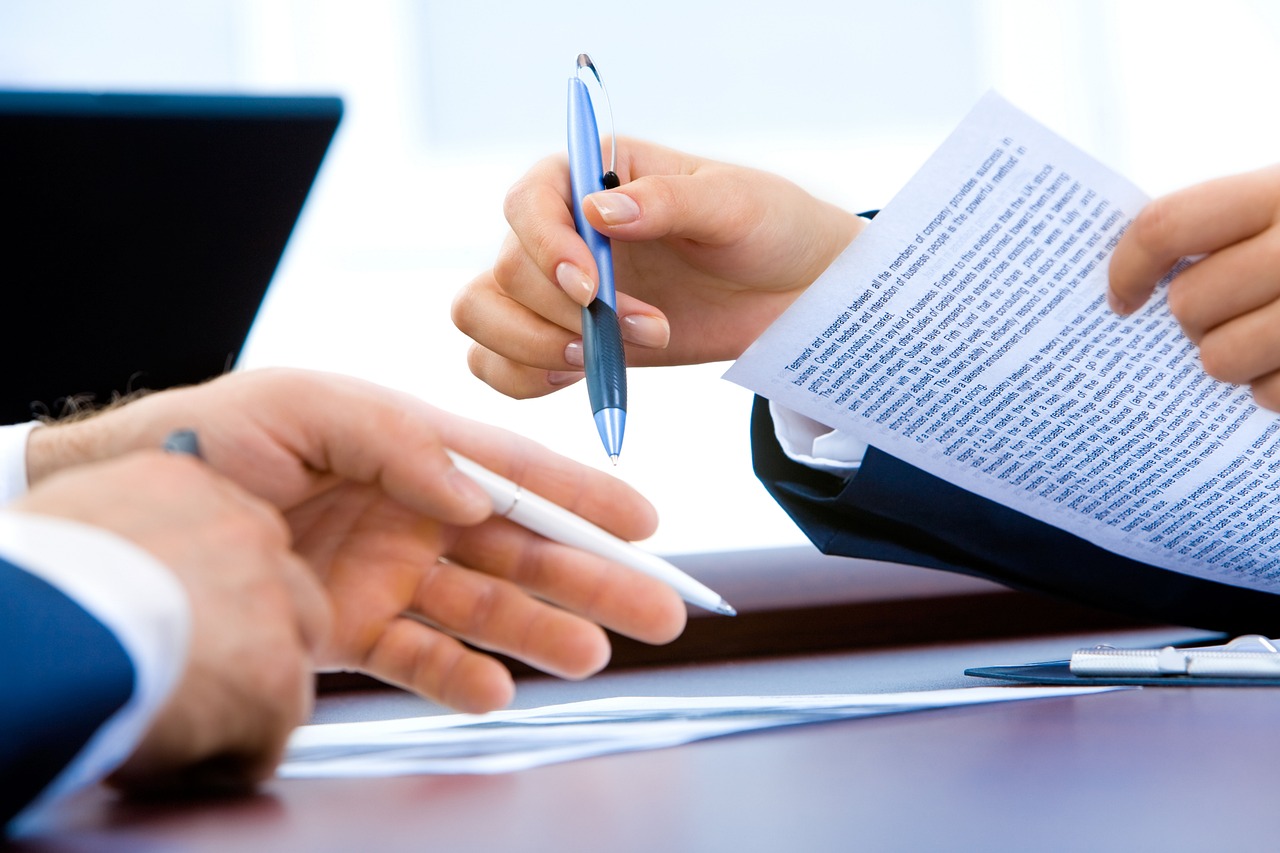 Marketing team writing brand voice guidelines on a whiteboard in an office