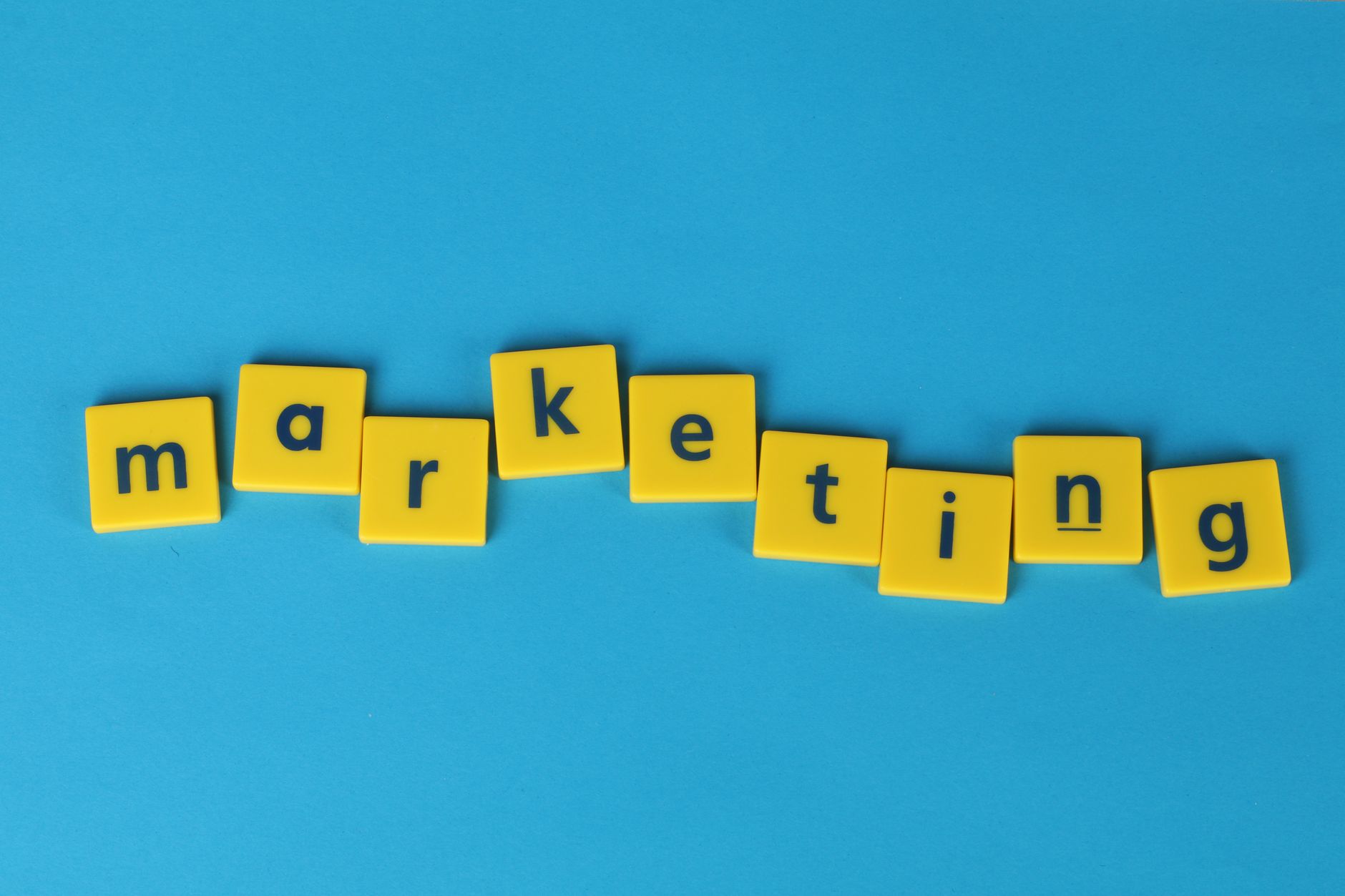 Marketing team members discuss brand voice guidelines at a conference table