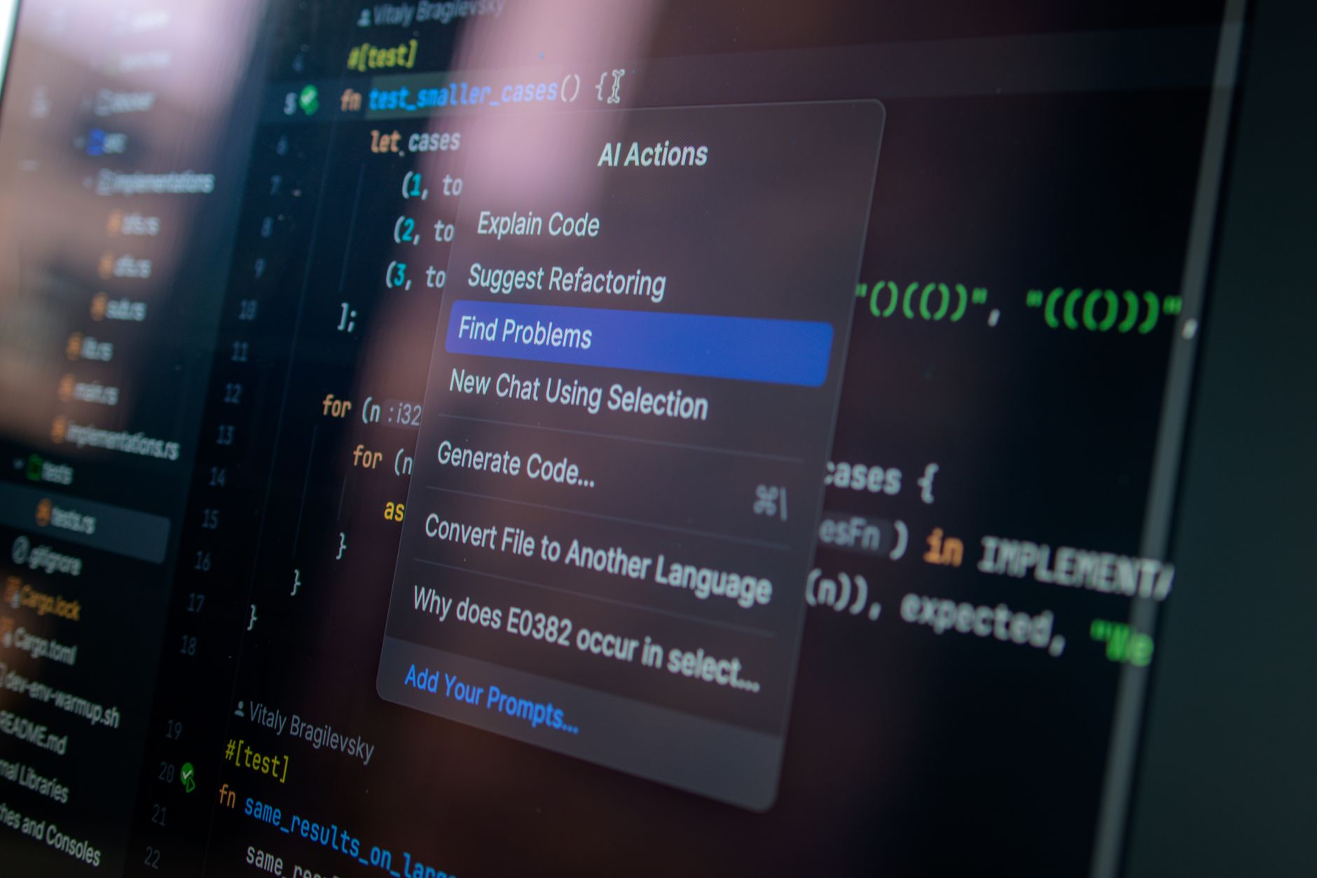 A person types on a laptop showing an AI chat interface.