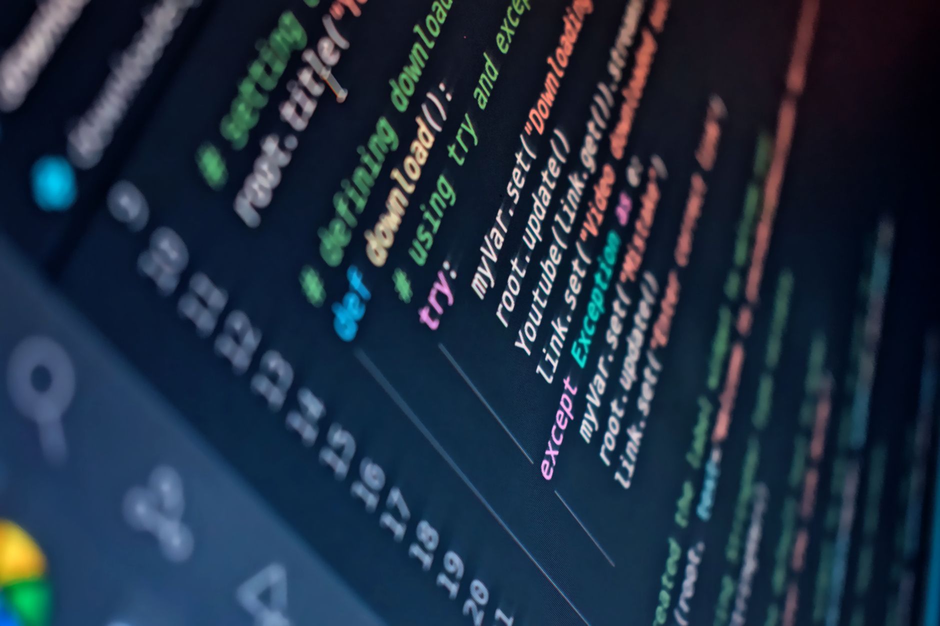 Developer using an AI-powered code editor on a large monitor.